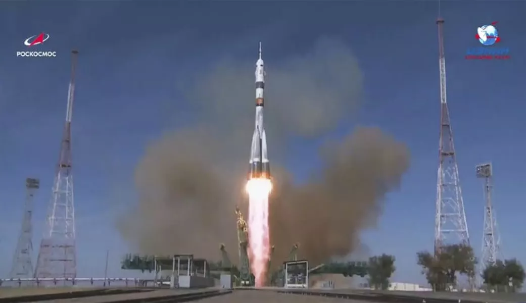 A rocket booster carrying the Soyuz MS-17 space ship blasts off at Baikonur cosmodrome in Kazakhstan (Roscosmos Space Agency/AP)