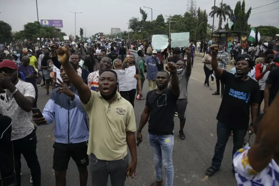 Demonstrators on the street (Sunday Alamba/AP)