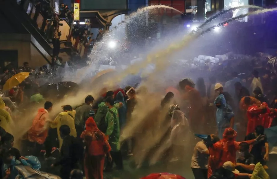 Water cannons drench protesters (Sakchai Lalit/AP)