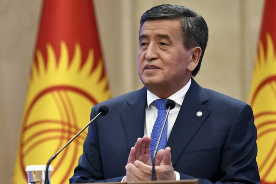 Sooronbai Jeenbekov applauds after delivering his speech during an official ceremony of transfer of the power at the Kyrgyzstan Parliament in Bishkek (Vladimir Voronin/AP)