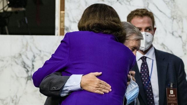 Democratic Senator Condemned By Allies For Hugging Republican Rival