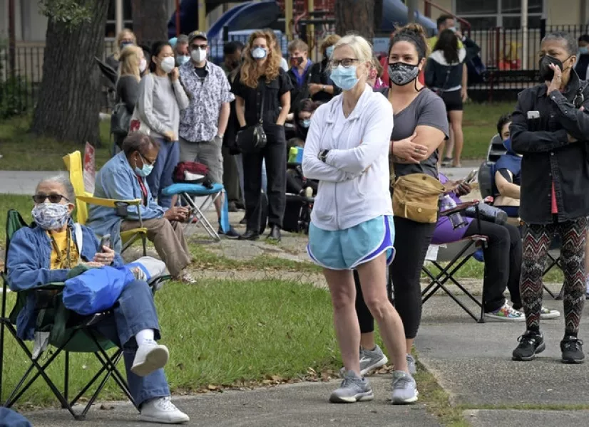 Voters wait in a long line in New Orleans on Friday. Photo: Max Becherer/The Advocate/AP