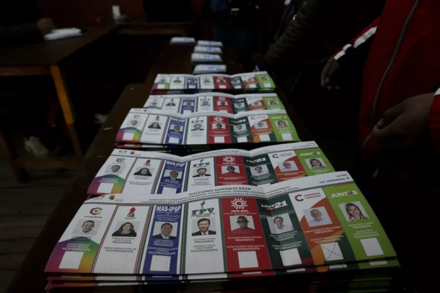 Ballots are placed on a table as they are being counted after polls closed in La Paz (AP)