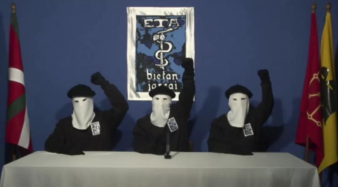 Masked members of ETA, seen in a video from 2011 (Gara/AP)