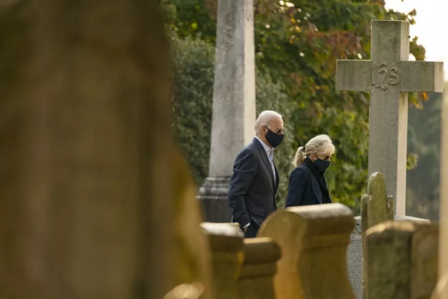 Mr Biden and his wife Jill arrive for Mass at Wilmington, Delaware (AP)