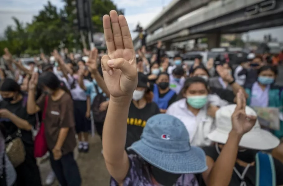 The three-fingered salute is a common gesture among the protesters (AP Photo/Sakchai Lalit)