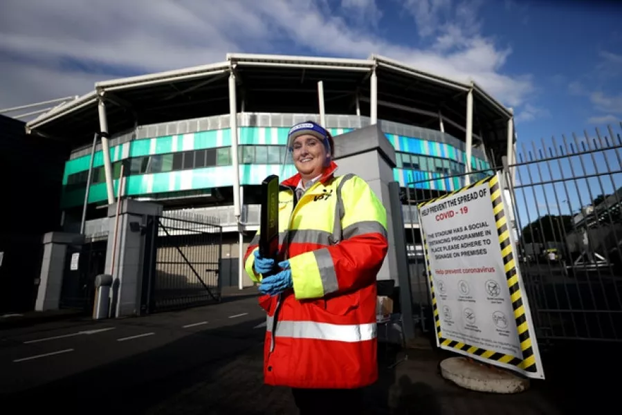 Security staff wearing PPE outside the stadium ahead of the Sadler’s Peaky Blinders Irish Cup Final match at Windsor Park, Belfast. Photo: Liam McBurney/PA