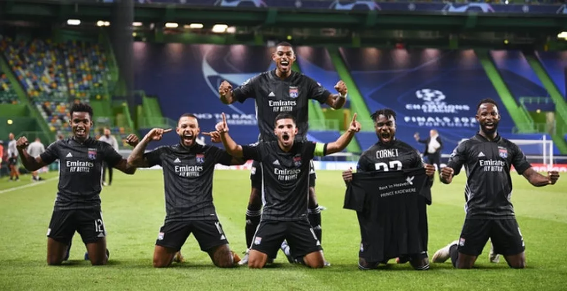 Lyon players celebrate their win (Franck Fife/AP)