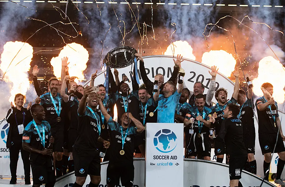 Soccer Aid World XI celebrate winning following the Soccer Aid match at Stamford Bridge last season. (Soccer Aid)