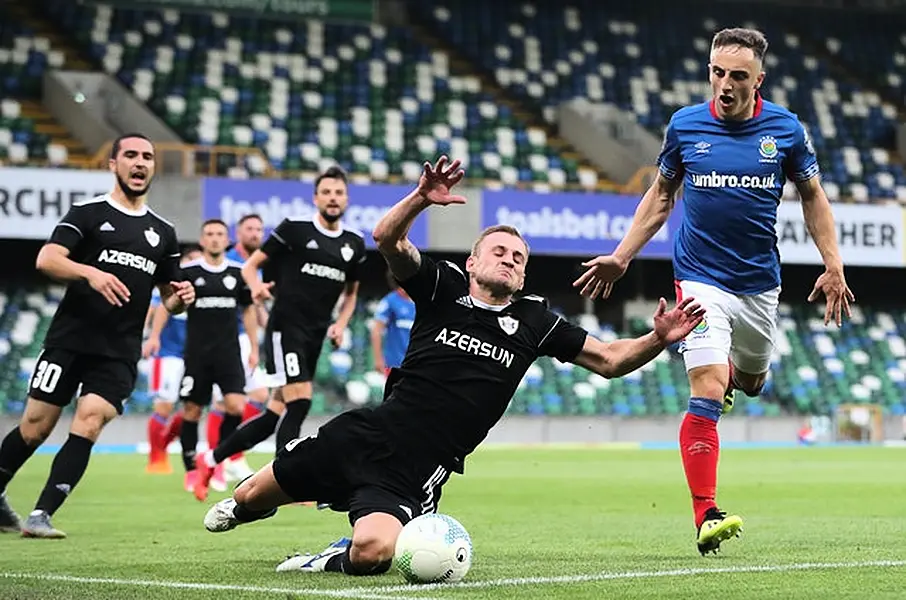 Former Linfield midfielder Joel Cooper, left, has replaced Mark Sykes in Baraclough’s squad (Niall Carson/PA)