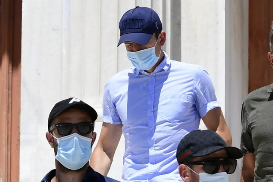 Harry Maguire, centre, leaves a court building on the island of Syros, Greece, on Saturday (Michael Varaklas/AP)