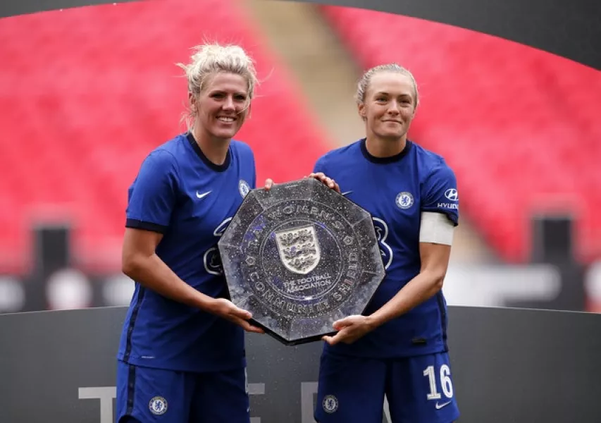 Millie Bright (left) and Magdalena Eriksson lift the trophy (Andrew Couldridge/PA)
