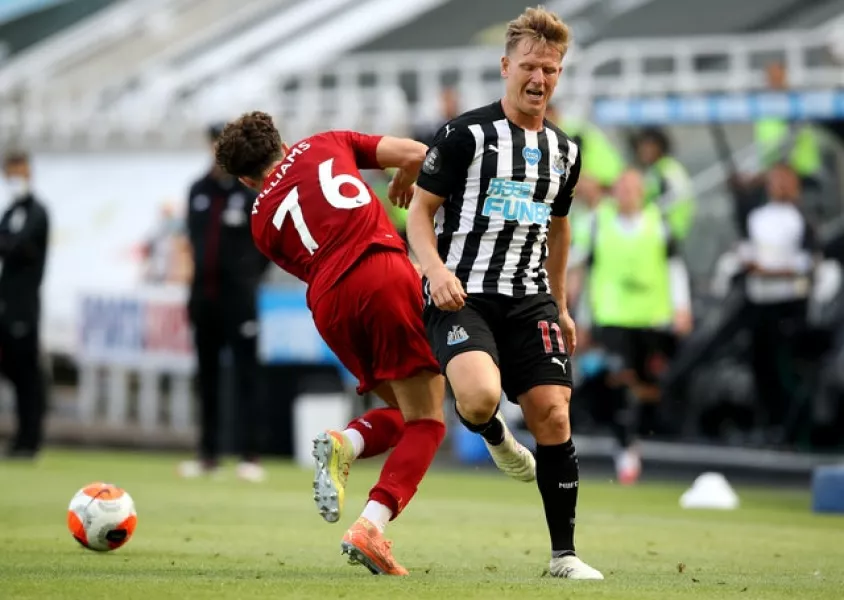 Matt Ritchie (right), pictured challenging Liverpool’s Neco Williams, has being offered to Bournemouth as part of a bid for Callum Wilson.