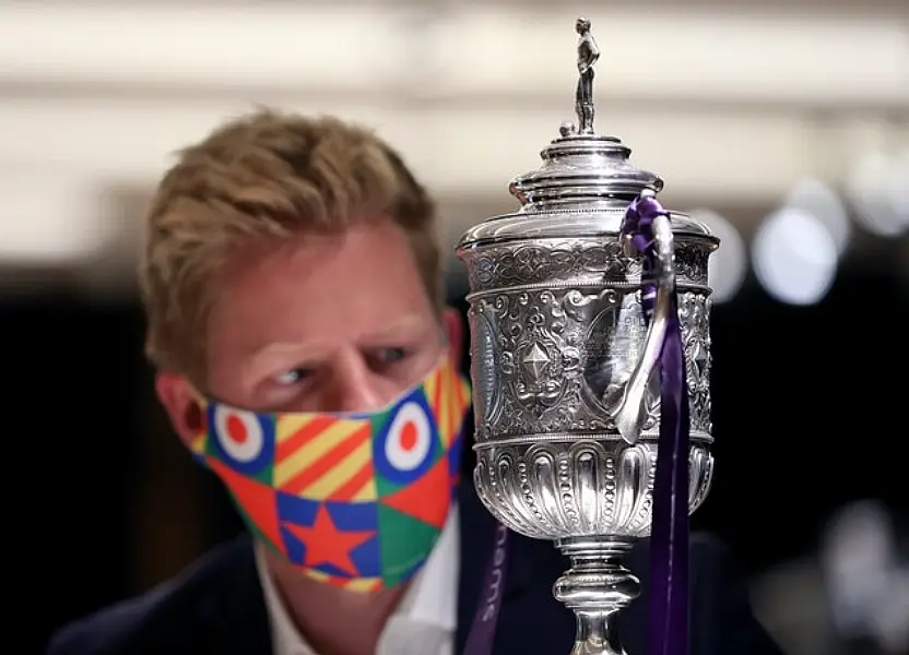 James Flower, of Bonhams, with the oldest surviving FA Cup trophy (Yui Mok/PA)