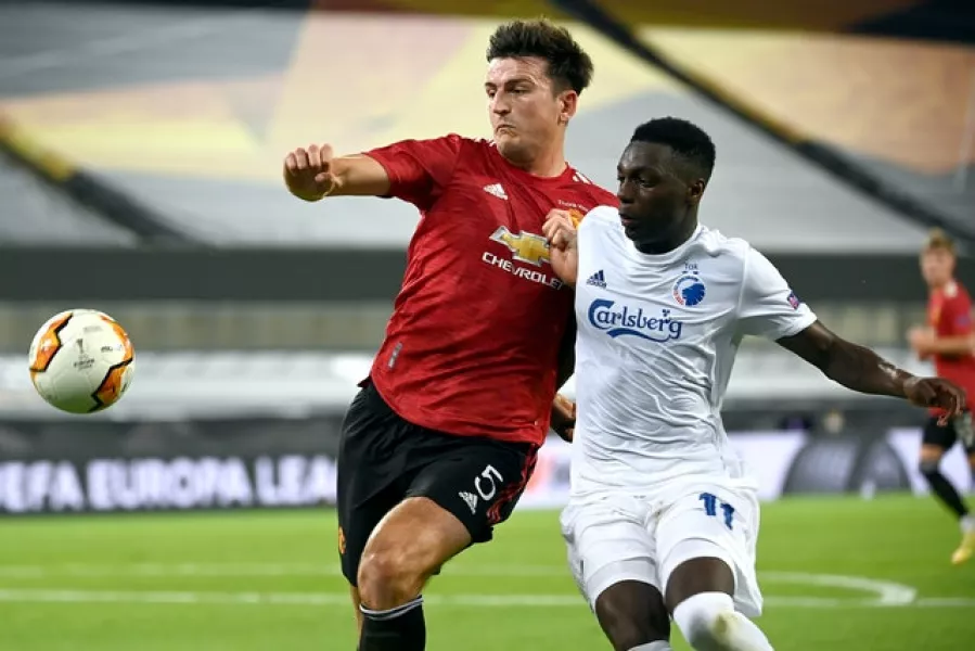 Manchester United’s Harry Maguire (left) and FC Copenhagen’s Mohamed Daramy battle for the ball during the Europa League quarter-finals at the Stadion Koln, Cologne.