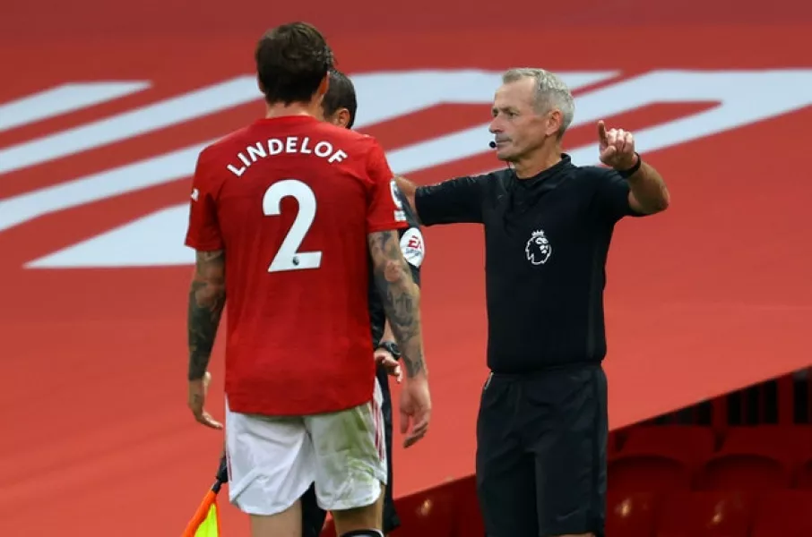Referee Martin Atkinson awarded a controversial penalty for a Victor Lindelof handball at Old Trafford (Richard Heathcote/PA)