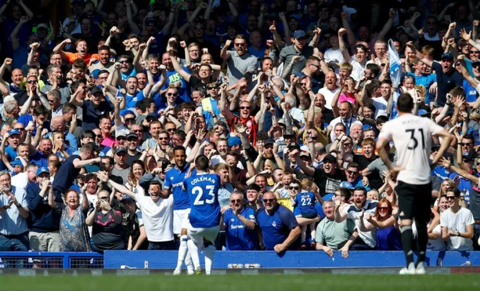 Theo Walcott (left) sends Goodison Park wild with a fourth goal against Manchester United in April 2019 (Martin Rickett/PA)