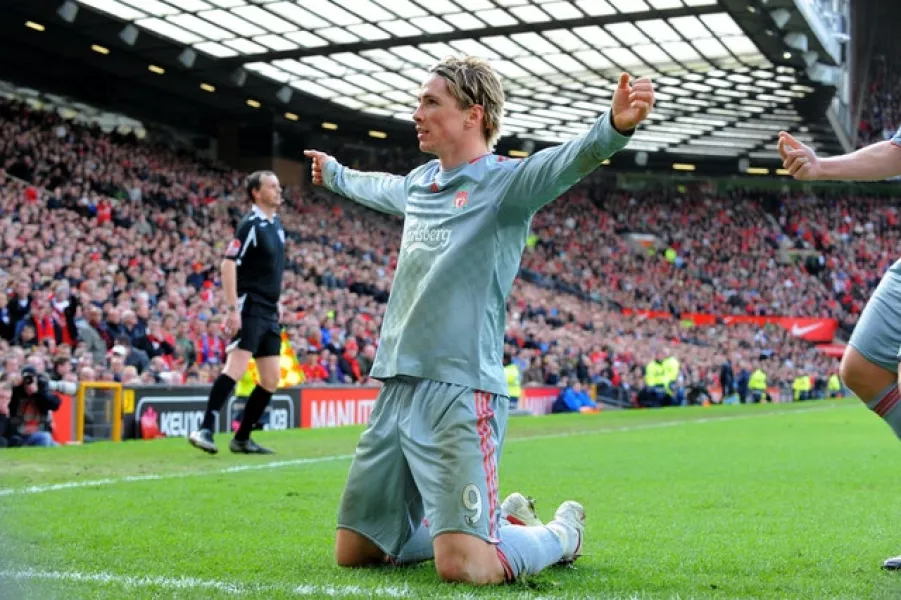 Fernando Torres celebrates after scoring in a 4-1 win for Liverpool at Old Trafford in 2009 (Peter Byrne/PA)
