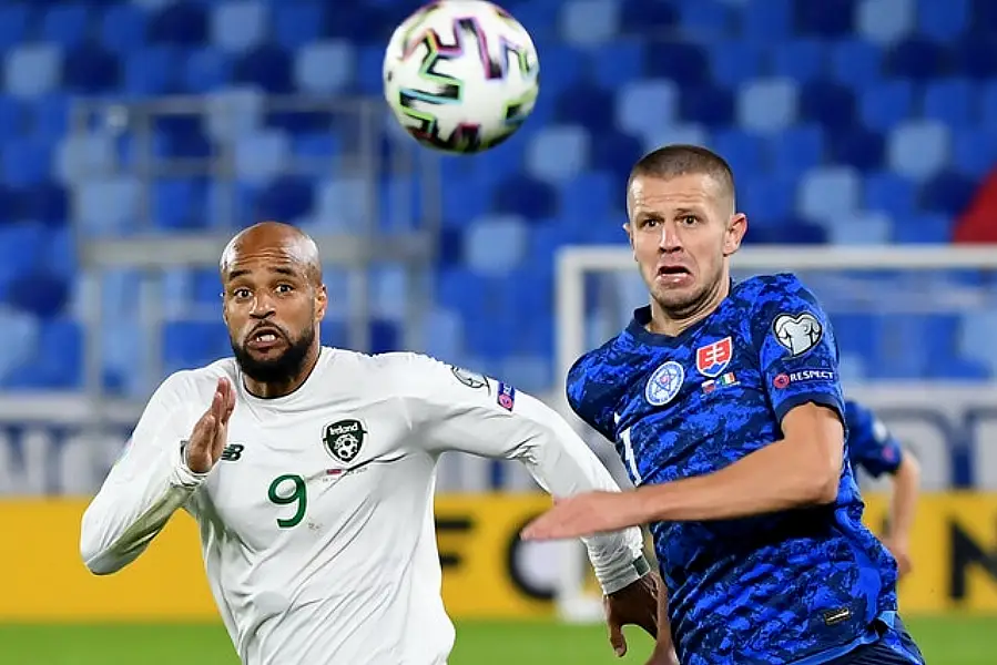 Republic of Ireland striker David McGoldrick, left, battles Slovakia’s Denis Vavro. Photo: Martin Baumann/PA