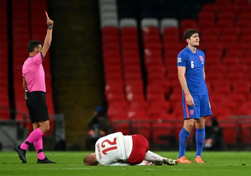 Harry Maguire is shown a red card (Daniel Leal Olivas/PA)