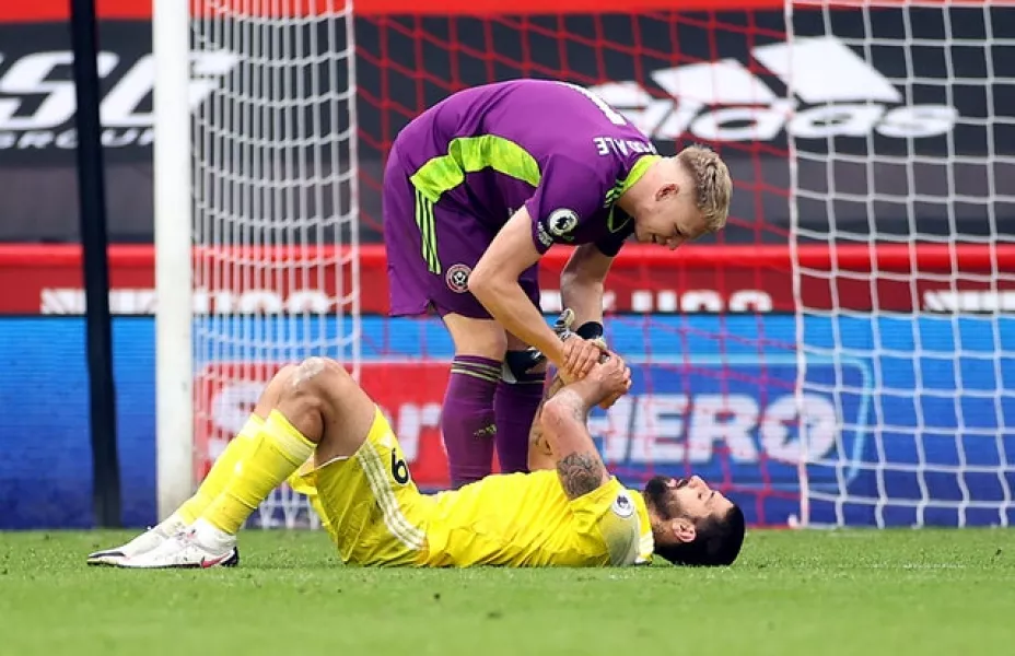 Fulham’s Aleksandar Mitrovic is consoled by Sheffield United goalkeeper Aaron Ramsdale after the striker missed a penalty and then conceded one in a 1-1 draw at Bramall Lane. Photo: PA