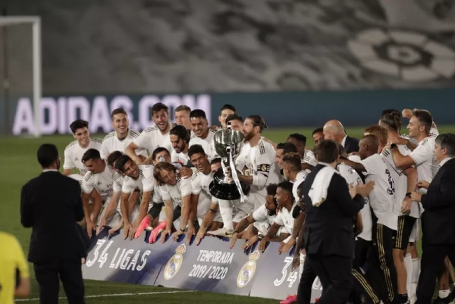 Bale (third from right) was not prominent as Real celebrated winning the title (Bernat Armangue/AP)