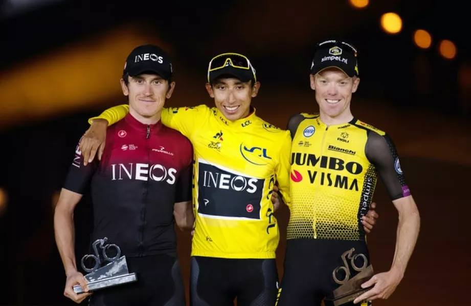 Egan Bernal (centre) celebrates his Tour de France win last year alongside Geraint Thomas (left) and Team Jumbo Visma’s Steven Kruijswijk (Pete Goding/PA).
