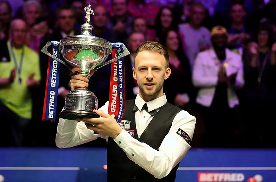 Judd Trump, the reigning world champion, trails Kyren Wilson (Richard Sellers/PA)