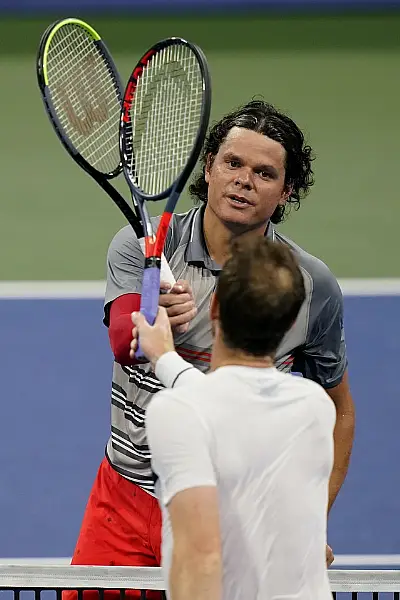 Murray and Raonic tap racquets after the match (Frank Franklin II/AP)