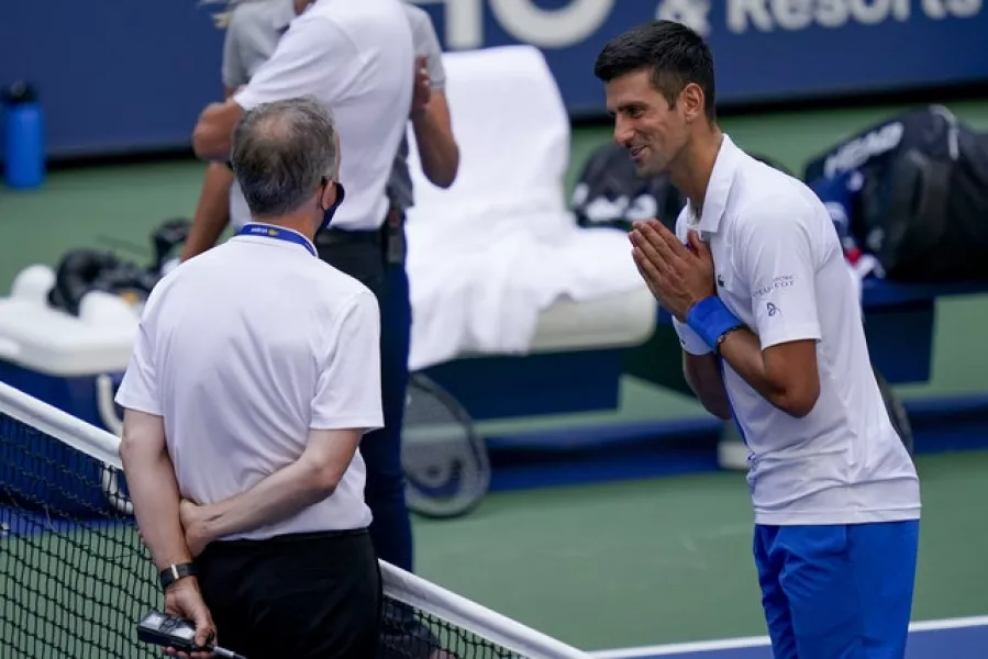 Novak Djokovic pleads with tournament referee Soeren Friemel (Seth Wenig/AP)