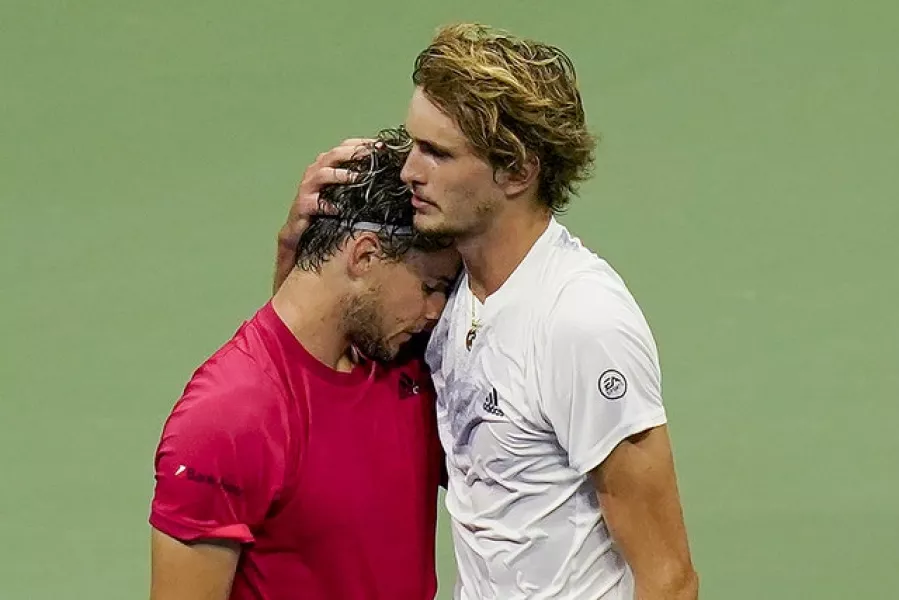 Alexander Zverev, right, hugs Dominic Thiem. Photo: Seth Wenig/AP