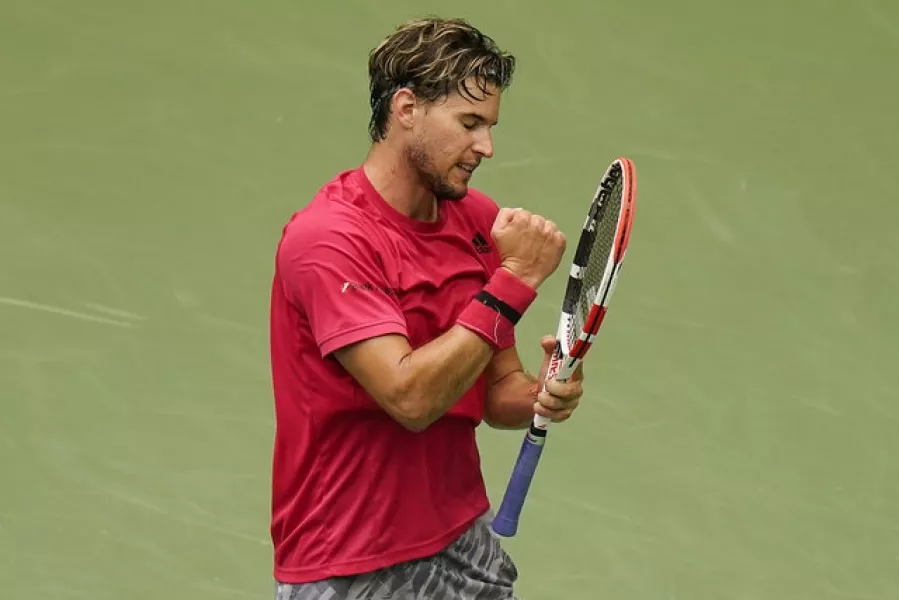 Dominic Thiem punches his racket in frustration. Photo: Seth Wenig/AP