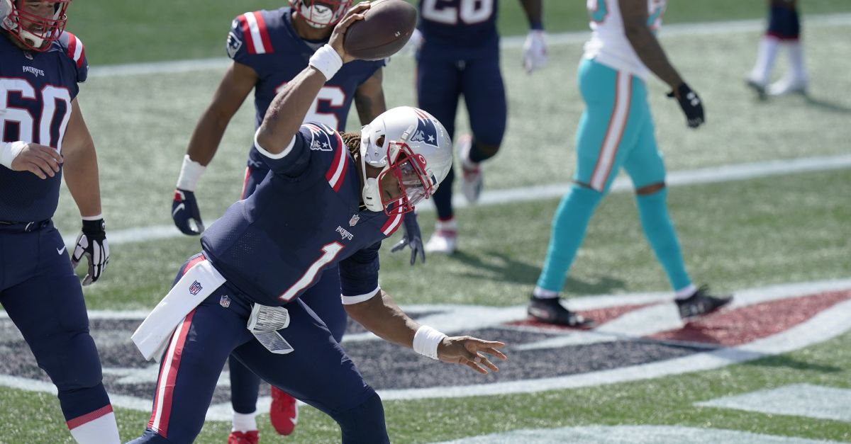 Newton runs for 2 TDs, Patriots hold off Dolphins 21-11