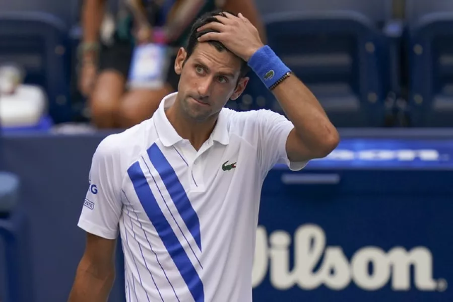 Novak Djokovic looks shocked after his disqualification from the US Open (Seth Wenig/AP)