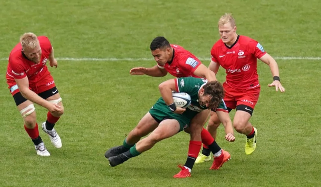 London Irish’s James Stokes is tackled down by Saracens fly-half Manu Vunipola (John Walton/PA)