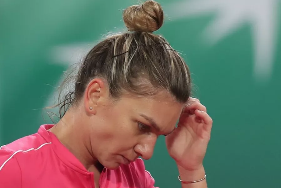 Simona Halep was unable to find the right answers against Iga Swiatek (Michel Euler/AP)