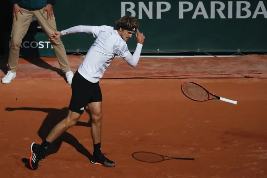 Alexander Zverev throws his racket to the ground during his loss to Jannik Sinner (Christophe Ena/AP)