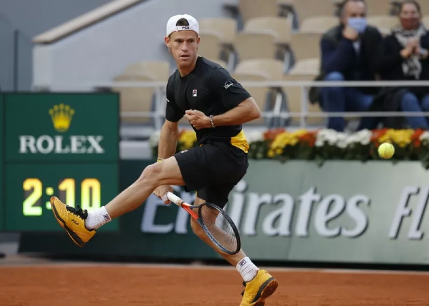 Diego Schwartzman plays a tweener during his defeat by Rafael Nadal (Michel Euler/AP)