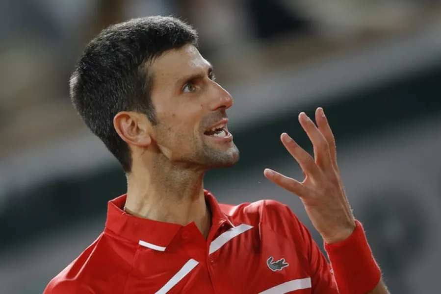 Novak Djokovic shows his frustration during his five-set tussle with Stefanos Tsitsipas (Michel Euler/AP)