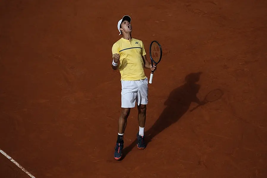 Daniel Altmaier roars after winning a point against Matteo Berrettini (Christophe Ena/AP)