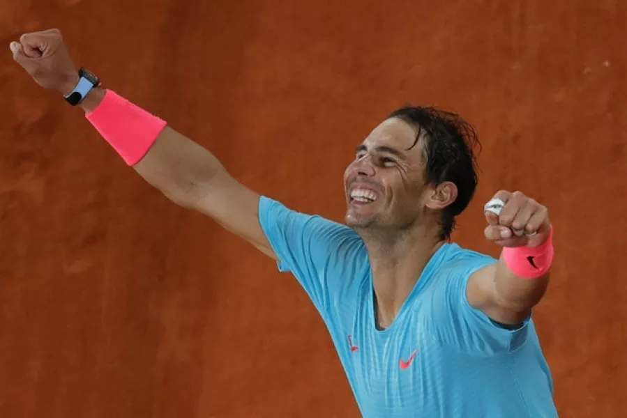 Rafael Nadal shows his delight at his 13th French Open title (Christophe Ena/AP)