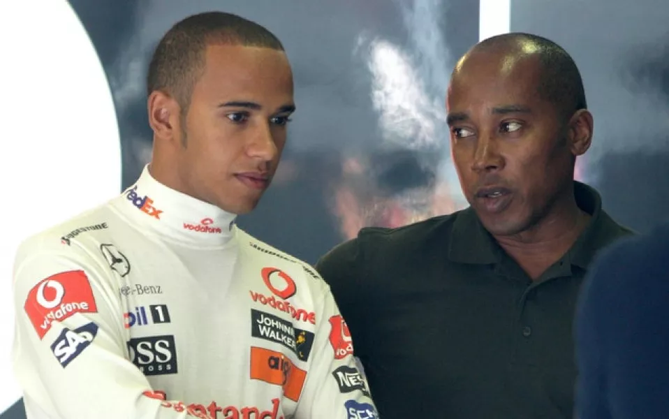 Lewis Hamilton, left, with his dad Anthony (Martin Rickett/PA)