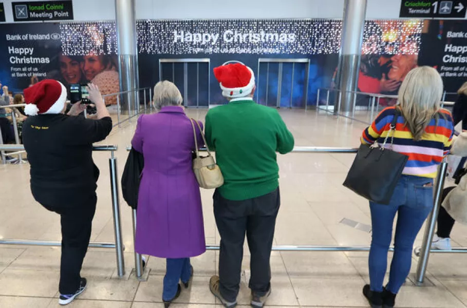  In Dublin Airport are people waiting for their loved ones to arrive, as the daa reports that today was the busiest day of the Christmas period for people coming home for the holidays. Photograph: RollingNews.ie