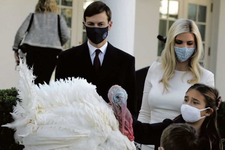 Jared Kushner, Ivanka Trump and their children pet the national Thanksgiving Turkey after it was pardoned during a traditional ceremony in the Rose Garden of the White House
