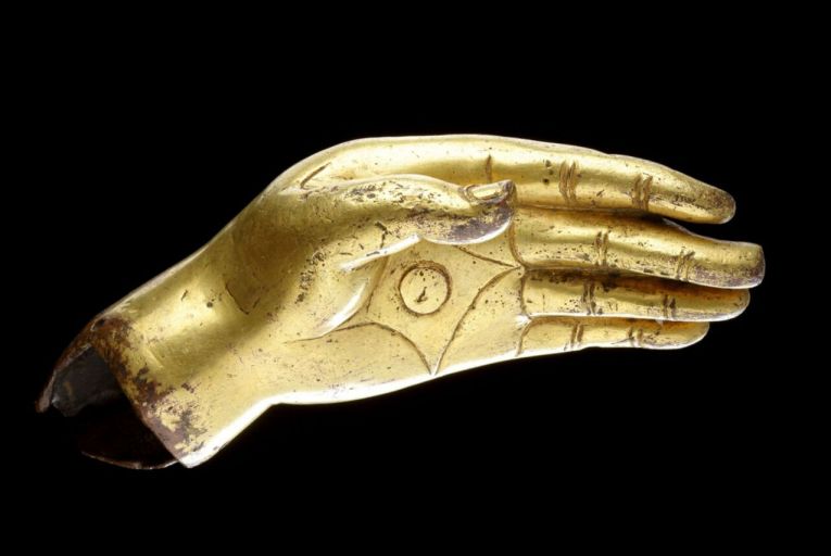A lifesize, Ming period, richly gilded bronze left hand of a Buddha  has an estimate of €6,750