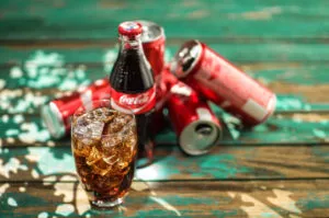 glass of Cola on blurred background