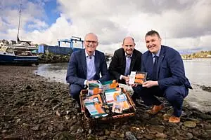 Pictured in Crosshaven, Co Cork (l-r) are Simon Coveney TD, Minister for Enterprise, Trade and Employment; Joe Manning, Commercial Director, Tesco Ireland, and Colman Keohane, Managing Director, Keohane Seafoods.