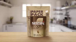 A Nescafe paper refill pack against the background of a bright kitchen