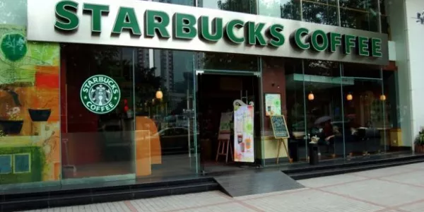 Starbucks Reports Cooling Quarterly Growth And Pares Outlook