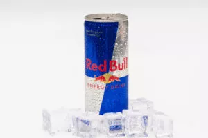 Aluminium can of Red Bull Energy drink with ice and drops. Red Bull is the most popular energy drink in the world.